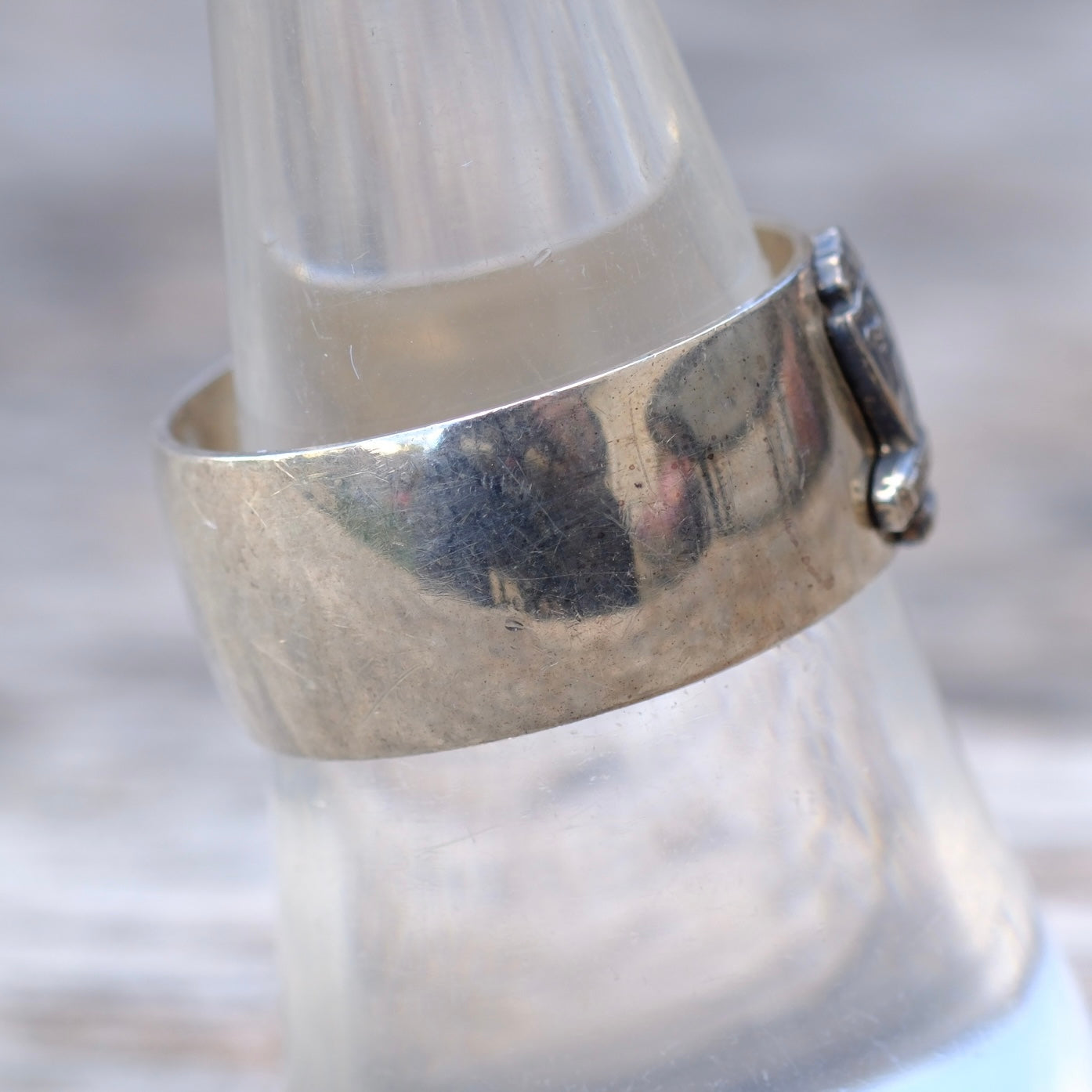 Silver ring on a white candle